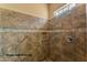 Large walk-in shower with tiled walls and grab bars at 20621 N Canyon Whisper Dr, Surprise, AZ 85387