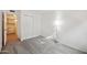 Bedroom with carpet flooring, laundry access, and a floor lamp at 2121 S Pennington Rd # 12, Mesa, AZ 85202