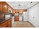 Kitchen with wood cabinets and tile floor at 2121 S Pennington Rd # 12, Mesa, AZ 85202