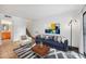 Inviting living room with staircase, tile floors, stylish decor, and a comfortable seating area at 2121 S Pennington Rd # 12, Mesa, AZ 85202