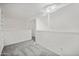 Open loft area with grey carpet and built in shelving at 2121 S Pennington Rd # 12, Mesa, AZ 85202