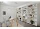 Bright home office with built-in shelving, ample storage, and a clean, organized workspace at 2121 S Pennington Rd # 12, Mesa, AZ 85202