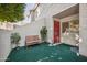 Private patio with artificial turf and bench at 2121 S Pennington Rd # 12, Mesa, AZ 85202