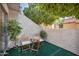 Small patio with artificial turf and chairs at 2121 S Pennington Rd # 12, Mesa, AZ 85202