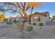 Landscaped backyard with view of neighboring homes at 2422 E Antigua Dr, Casa Grande, AZ 85194