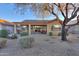 Home's backyard with desert landscaping and patio at 2422 E Antigua Dr, Casa Grande, AZ 85194