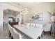 Bright dining room features a large table and statement chandelier at 24400 N 72Nd Way, Scottsdale, AZ 85255