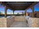 Outdoor kitchen with built-in grill and pergola at 24400 N 72Nd Way, Scottsdale, AZ 85255