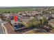 Aerial view showing a house with a pool in a residential neighborhood at 24810 W Huntington Dr, Buckeye, AZ 85326