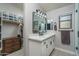 Elegant bathroom with a modern vanity, quartz countertop and frameless shower at 24810 W Huntington Dr, Buckeye, AZ 85326