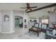 Living room with an open layout, offering a view into the kitchen at 24810 W Huntington Dr, Buckeye, AZ 85326