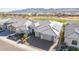 Home with solar panels and a golf course in the background at 26203 W Maple Dr, Buckeye, AZ 85396