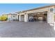 Spacious three-car garage with golf cart and storage at 26203 W Maple Dr, Buckeye, AZ 85396