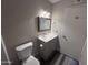 This bathroom features a gray vanity with modern sink, mirror and toilet at 2629 W Ocotillo Rd # 3, Phoenix, AZ 85017