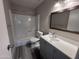 This bathroom includes a modern vanity, tub-shower combo, and toilet at 2629 W Ocotillo Rd # 3, Phoenix, AZ 85017