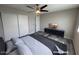 Serene bedroom with ample closet space, a sleek entertainment center, and modern bedding for a restful retreat at 2629 W Ocotillo Rd # 3, Phoenix, AZ 85017