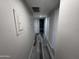 Hallway view with gray plank floors and closet at 2629 W Ocotillo Rd # 3, Phoenix, AZ 85017