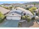 Two-story house with a three car garage, and a pool in the backyard at 2705 E Verbena Dr, Phoenix, AZ 85048