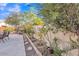 Landscaped backyard with stone patio and lush greenery at 2705 E Verbena Dr, Phoenix, AZ 85048