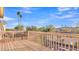 Balcony with wooden deck and railing overlooking desert landscaping and mountain views at 2705 E Verbena Dr, Phoenix, AZ 85048