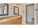 Bathroom features double sinks, granite countertops, wood cabinets, and tile flooring at 2705 E Verbena Dr, Phoenix, AZ 85048