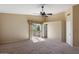 Spacious bedroom with ceiling fan, sliding glass doors leading to the outside at 2705 E Verbena Dr, Phoenix, AZ 85048
