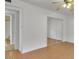 Bright bedroom with mirrored closet and light wood flooring at 2705 E Verbena Dr, Phoenix, AZ 85048