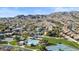 Panoramic view of community amenities including a pool, tennis courts, and mountain views at 2705 E Verbena Dr, Phoenix, AZ 85048