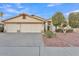 House exterior featuring a three-car garage and well-maintained landscaping at 2705 E Verbena Dr, Phoenix, AZ 85048