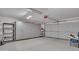 Spacious garage with built-in storage cabinets and shelving at 2705 E Verbena Dr, Phoenix, AZ 85048