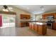 Bright kitchen with granite countertops, a center island, stainless steel appliances, and tile flooring at 2705 E Verbena Dr, Phoenix, AZ 85048