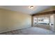 Bright living room with large windows and neutral carpet at 2705 E Verbena Dr, Phoenix, AZ 85048