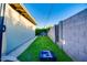 Backyard with grassy area and cornhole game at 2806 N 82Nd St, Scottsdale, AZ 85257