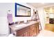 Double vanity bathroom with dark brown cabinets and a large mirror at 2806 N 82Nd St, Scottsdale, AZ 85257