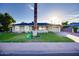 Single-story home with attractive landscaping and a large palm tree at 2806 N 82Nd St, Scottsdale, AZ 85257
