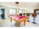 Pool table in a game room with kitchen access and bar seating at 2806 N 82Nd St, Scottsdale, AZ 85257