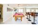Game room showcasing a pool table, bar stools, and an adjacent kitchen at 2806 N 82Nd St, Scottsdale, AZ 85257