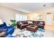 Spacious living room featuring a large leather sectional sofa and a decorative area rug at 2806 N 82Nd St, Scottsdale, AZ 85257