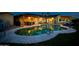Night view of the kidney shaped pool and backyard at 2806 N 82Nd St, Scottsdale, AZ 85257