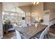 Farmhouse style dining room with large wooden table and seating for eight at 2920 E Fox St, Mesa, AZ 85213