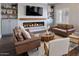 Living room with a linear fireplace and built-in shelving at 2920 E Fox St, Mesa, AZ 85213