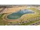 Aerial view of lake with surrounding fields at 3045 E Bloomfield Pkwy, Gilbert, AZ 85296