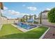 Inviting backyard oasis featuring a refreshing pool, lush landscaping, and a relaxing patio area at 3045 E Bloomfield Pkwy, Gilbert, AZ 85296