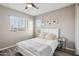 Charming bedroom with a queen bed and neutral color scheme at 3045 E Bloomfield Pkwy, Gilbert, AZ 85296
