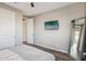 Bright bedroom with a queen bed and full-length mirror at 3045 E Bloomfield Pkwy, Gilbert, AZ 85296