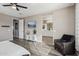 Spacious bedroom with ensuite bathroom access and a cozy sitting area at 3045 E Bloomfield Pkwy, Gilbert, AZ 85296