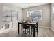Bright dining room features a table with four chairs and large windows at 3045 E Bloomfield Pkwy, Gilbert, AZ 85296