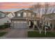 Two-story home with gray exterior, double garage, and landscaped yard at 3045 E Bloomfield Pkwy, Gilbert, AZ 85296