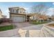 Two-story home with gray exterior, double garage, and landscaped yard at 3045 E Bloomfield Pkwy, Gilbert, AZ 85296