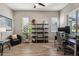 Bright home office features built-in shelving and hardwood floors at 3045 E Bloomfield Pkwy, Gilbert, AZ 85296